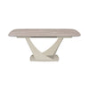 A modern rectangular dining table with a light beige marble-look top and a sculptural, curved cream-colored base, shown on a solid white background.