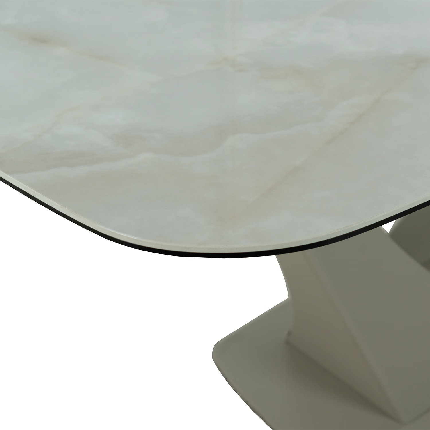Close-up of a modern dining table showing a curved white marble-look top with a thin black edge and a sculptural white pedestal base against a white background.
