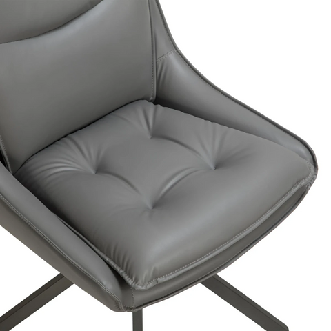 Close up of Seat cushion on the Vogue Leather Effect Grey Swivel Dining Chairs with Black Legs – Set of 4, 6 or 8