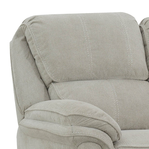 Close-up of a light gray upholstered recliner sofa showing the backrest cushion, armrest, and fabric texture against a white background.