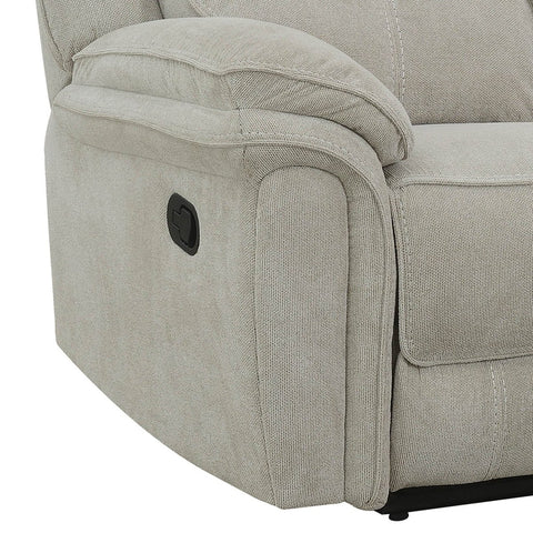 Close-up of a light beige upholstered recliner sofa showing the armrest, side panel, and a black power control button on a white background.