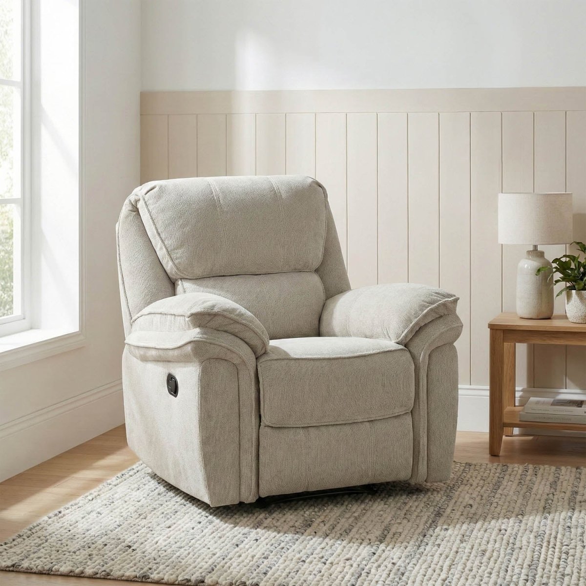 Westminister Beige recliner chair in a living room setting with a lamp and small table.