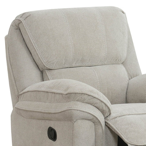 Close-up of a westminister light beige textured fabric recliner chair showing the backrest, armrest, and a black power control button.
