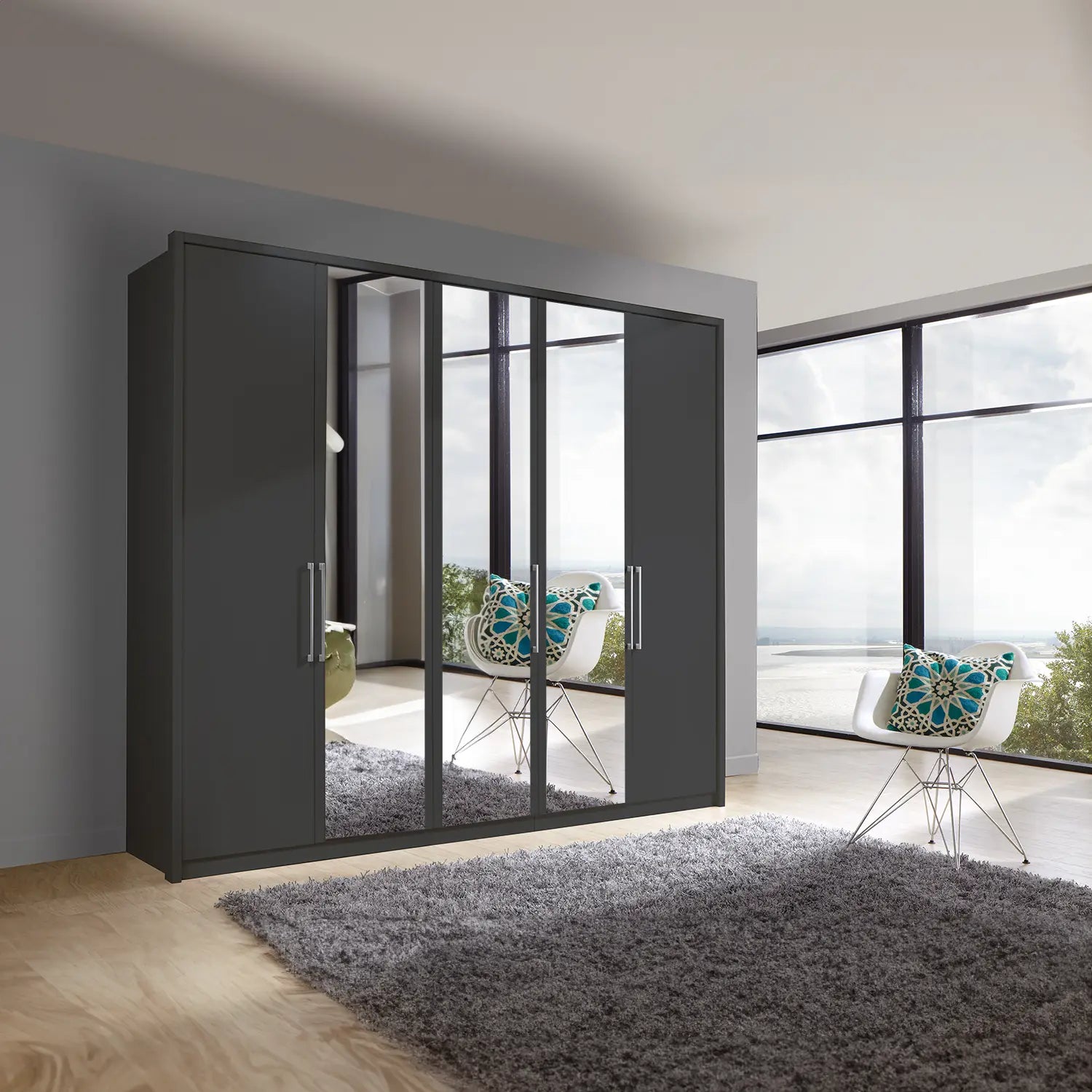 Image of Wiemann Bristol 5 Door Wardrobe with Graphite Carcase. Option of Matt or Glass finish on side doors, with middle doors featuring mirror pads. Dimensions: Width 250cm, Height 216cm, Depth 58cm. Free Delivery and Assembly. 12 months interest-free pay monthly available. - Lifestyle Image