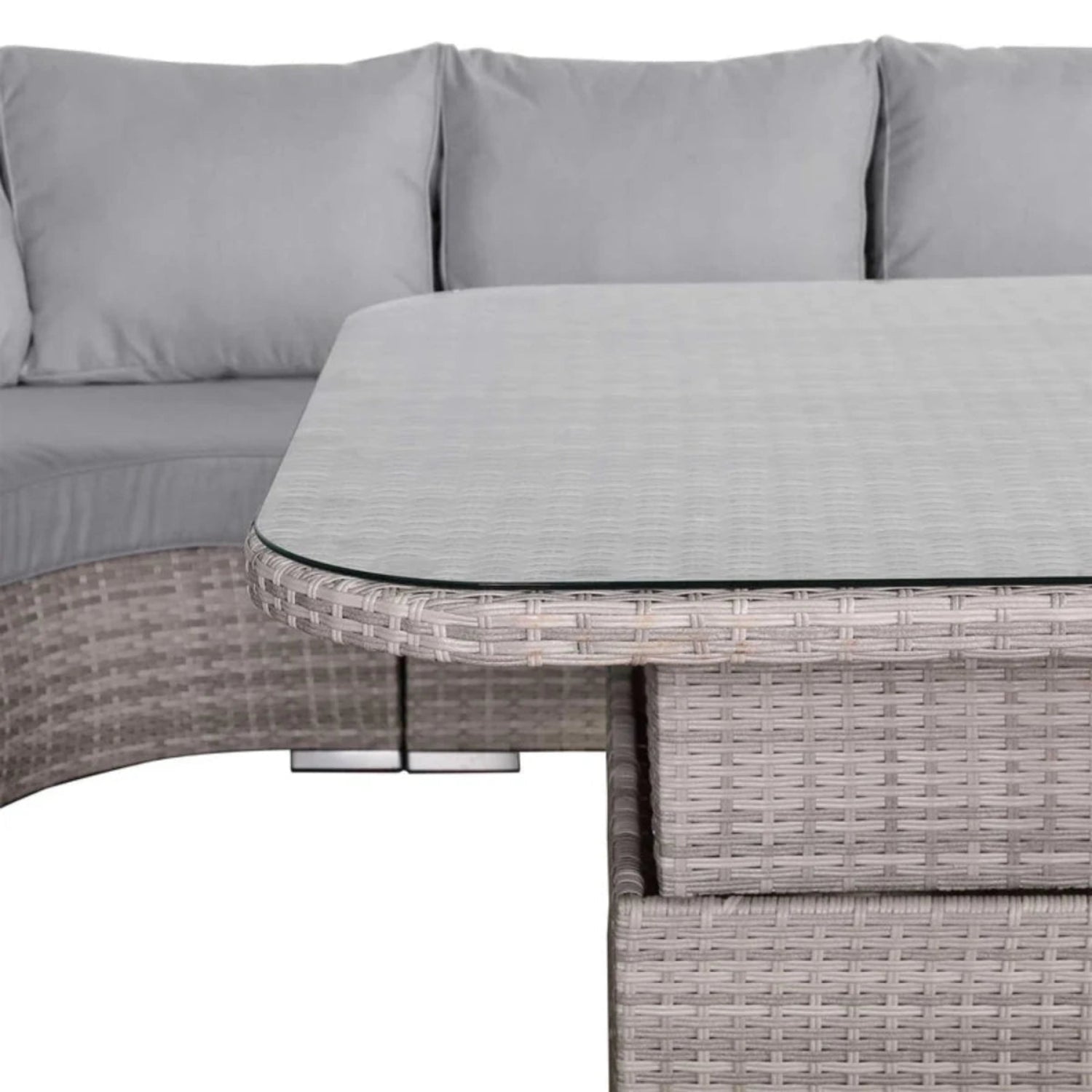 Clear glass surface on outdoor rising table with modern design.