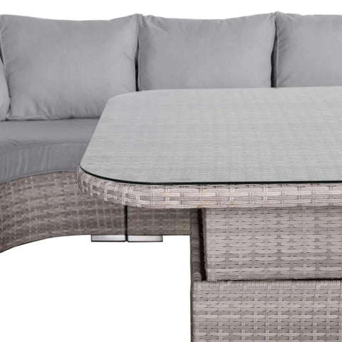 Clear glass surface on outdoor rising table with modern design.