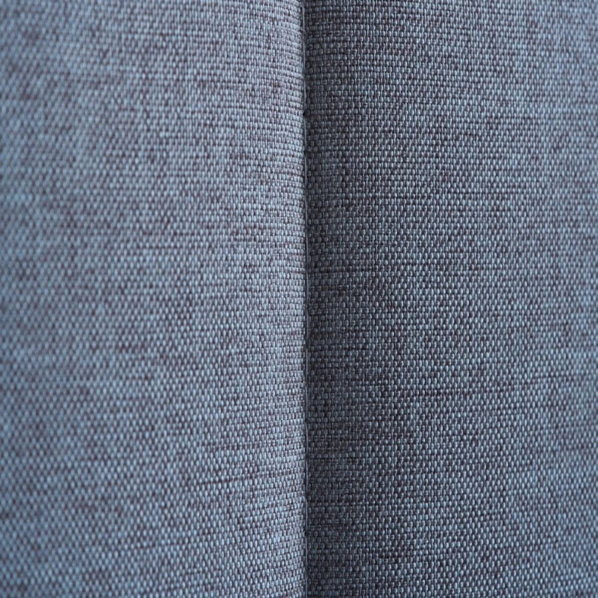 Grey fabric and oak effect bed frame for modern interiors.