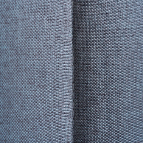 Grey fabric and oak effect bed frame for modern interiors.