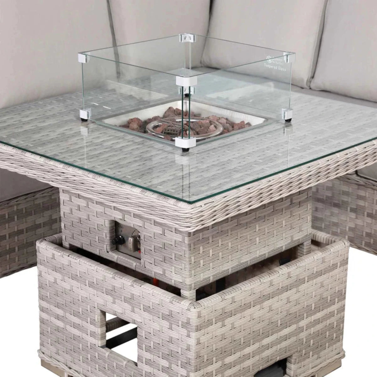 Rising firepit table with adjustable coffee and dining height.
