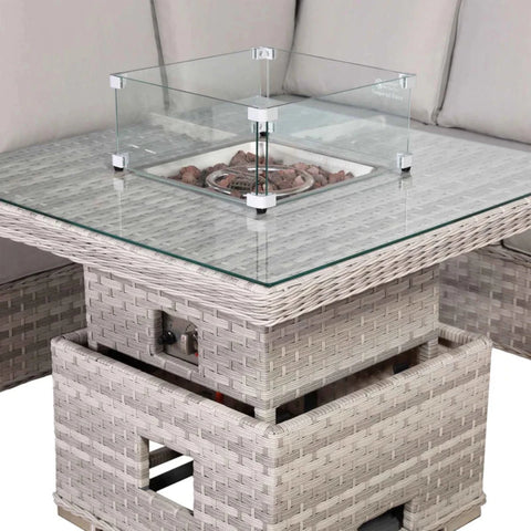 Rising firepit table with adjustable coffee and dining height.