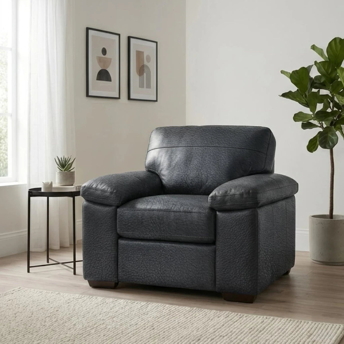 Zuzu Leather Oslo armchair with coil sprung foam seating and modern design.