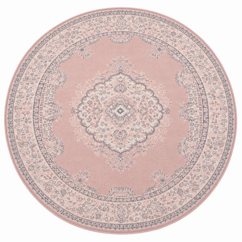 Round blush rug for minimalist and feminine spaces.