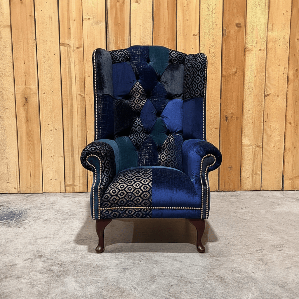 Dorset blue patchwork Chesterfield wing chair by Oswald & Pablo with rolled arms and fixed seat. Handmade in the UK, available in 3 heights.